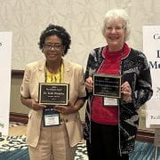 RICE AWARDS — Yeshi Wamishe, left, and Karen Moldenhauer accept awards at the USA Rice Outloook Conference on Dec. 8 in Austin, Texas. (U of A System Division of Ag photo by John Carlin)