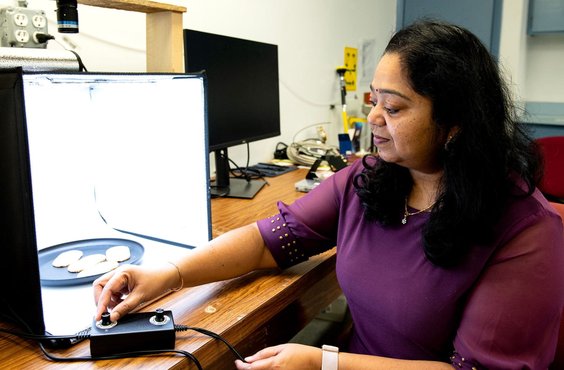 IMAGING SYSTEM — Swarna Sethu, post-doctoral researcher in biological and agricultural engineering, is the lead entrepreneur in a National Science Foundation I-Corps grant. Sethu and her research team are planning to market an artificial intelligence-guided imaging system that can predict consumer acceptance of food products based on sight. (U of A System Division of Agriculture photo by Fred Miller)