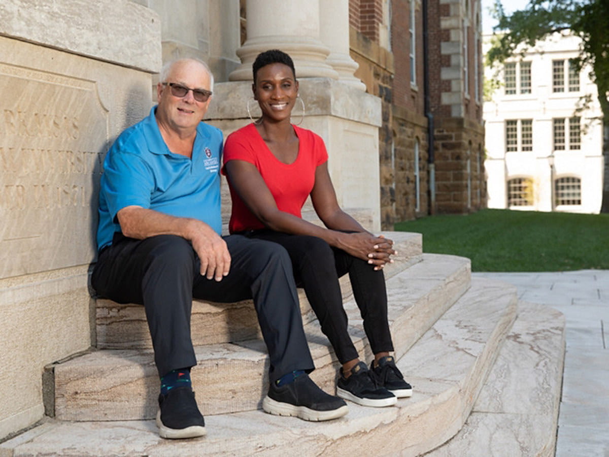 RECOGNITION — University Professor Douglas Rhoads with Tameka Bailey, assistant professor of biological sciences. Rhoads has been named a Fellow of the American Association for the Advancement of Science. (Photo courtesy of University Relations)