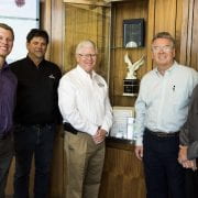 CELEBRATING SUCCESS — Dan Street, far right, is retiring as the director of design and construction for the University of Arkansas Division of Agriculture. He stands in this July 2018 photo recognizing Nabholz Construction's Award of Excellence for its work on the Don Tyson Center for Agricultural Sciences. Also pictured are Chris Kotter and Mark Dilday of Nabholz Construction, left; Mark Cochran, then-vice president for agriculture; and David Sargent of WER Architects. (U of A System Division of Agriculture photo)