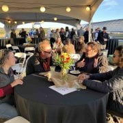 FARMERS FOR TOMORROW — Brian Foster, center left, of Sunny Acres Farms speaks with Farmers for Tomorrow fund supporters at the 2022 fundraising event.