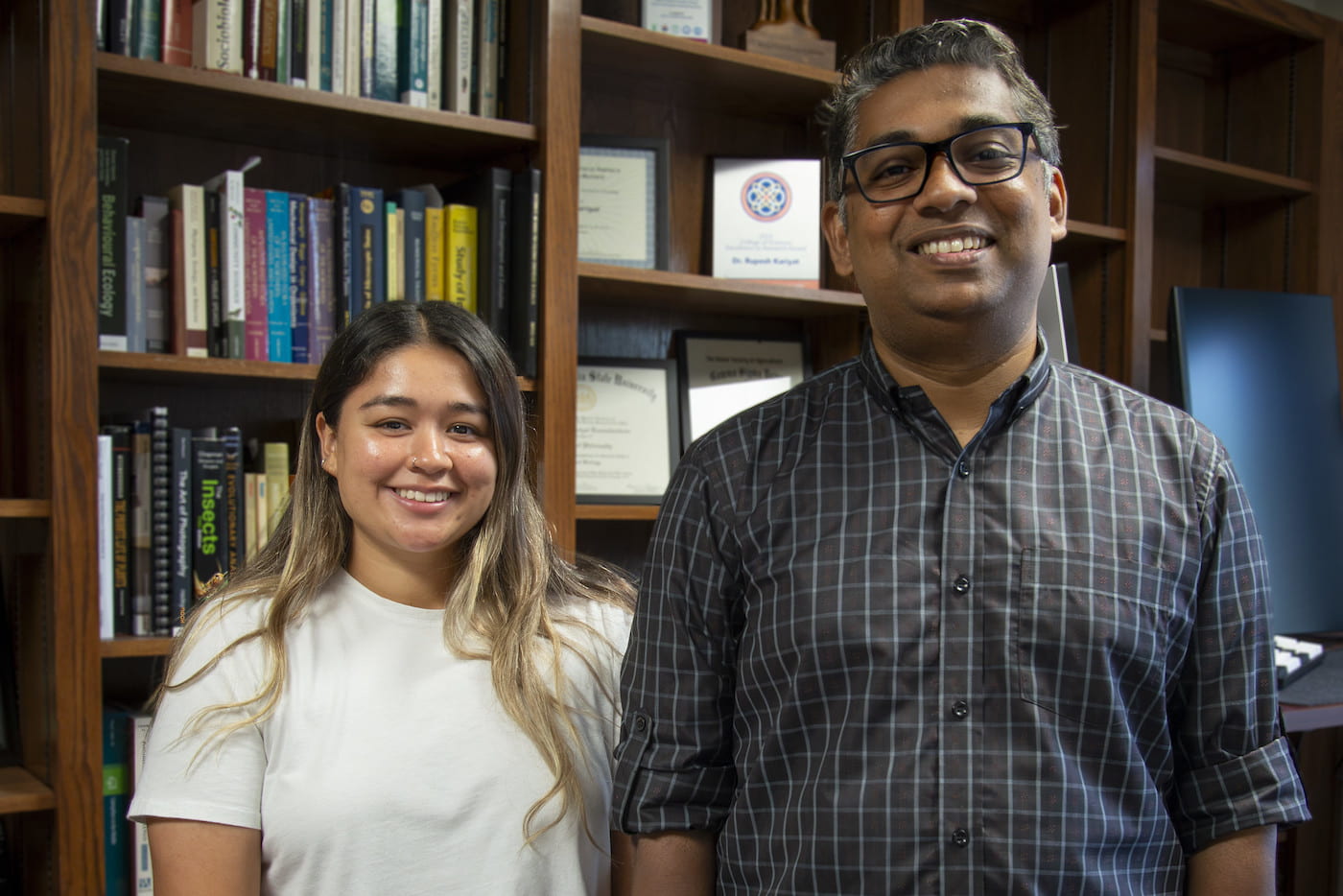NEW OPPORTUNITIES — Evelyn Madrigal, left, stands with her adviser Rupesh Kariyat, associate professor of crop entomology for the Arkansas Agricultural Experiment Station.