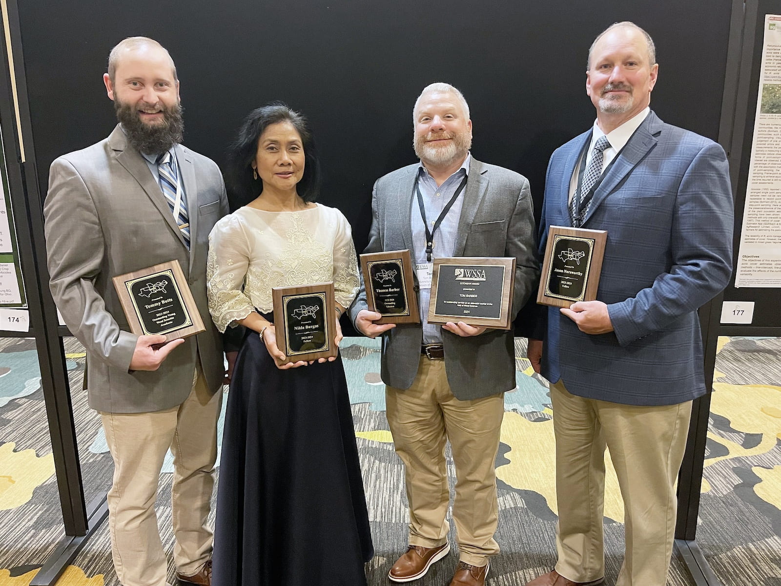 From left, Tommy Butts, Nilda Burgos, Tom Barber and Jason Norsworthy. The four were among those earning honors at the Weed Science Society of America annual meeting in San Antonio, Texas. Taken Jan. 22, 2024. (U of A System Division of Agriculture photo by Bob Scott)