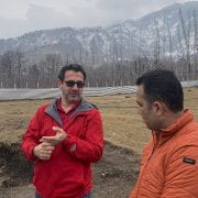 CLEAN PLANT PROGRAM — Ioannis Tzanetakis, left, speaks with a plant nursery worker near Srinagar, India, in late 2023 as part of work with the Clean Plant Program of India. (Photo courtesy Ioannis Tzanetakis)