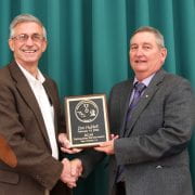 DISTINGUISHED SERVICE — Don Hubbell, right, accepts plaque as Distinguished Service Award winner, from Larry Earnest, director of the Rohwer Research Station in Arkansas. (U of A System Division of Agriculture photo by Mary Hightower)