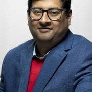 Portrait photo of Aranyak Goswami against a white background.