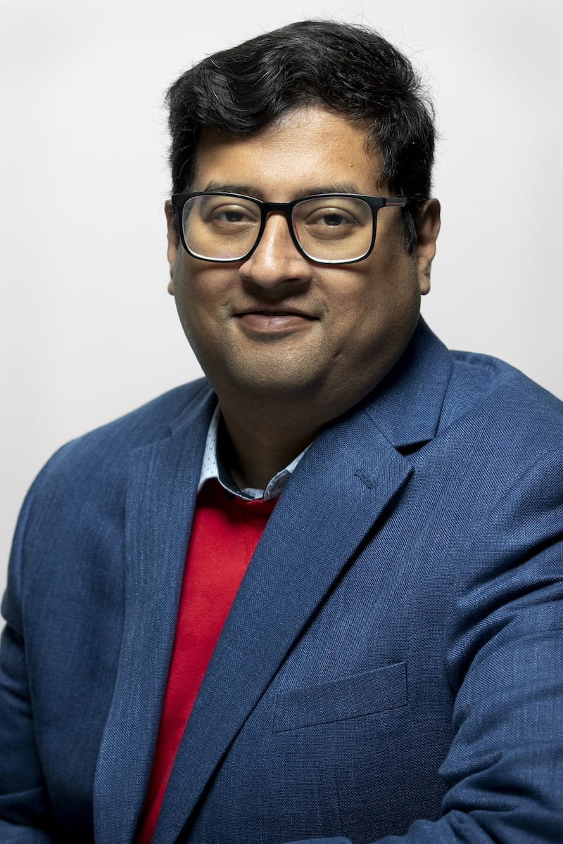 Portrait photo of Aranyak Goswami against a white background.