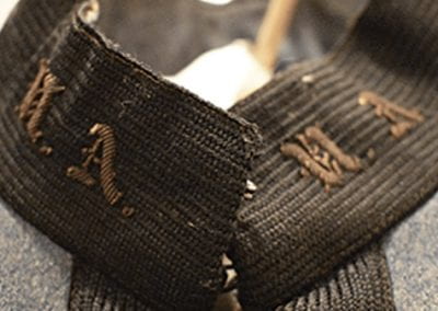 A detail photograph of the Corps of Cadets uniform once belonging to Ernest Paul O’Neal, a University of Arkansas alumnus and WWI veteran. Courtesy University of Arkansas Museum Collections.