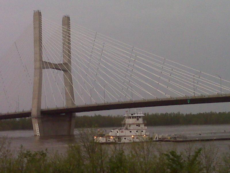 a barge going under a bridge