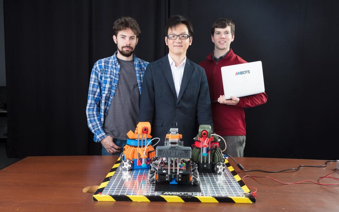 Lucas Marques, Assistant Professor of Mechanical Engineering Wenchao Zhou and Austin Williams started AMBOTS to advance their vision for the next generation of manufacturing technology. The group conducts their research in the Arkansas Research and Technology Park.