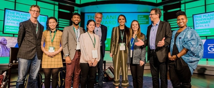 Haley Knighten (third from right) and Christina Trexler (center) celebrate with other Planet Forward award winners. Photo courtesy Planet Forward.