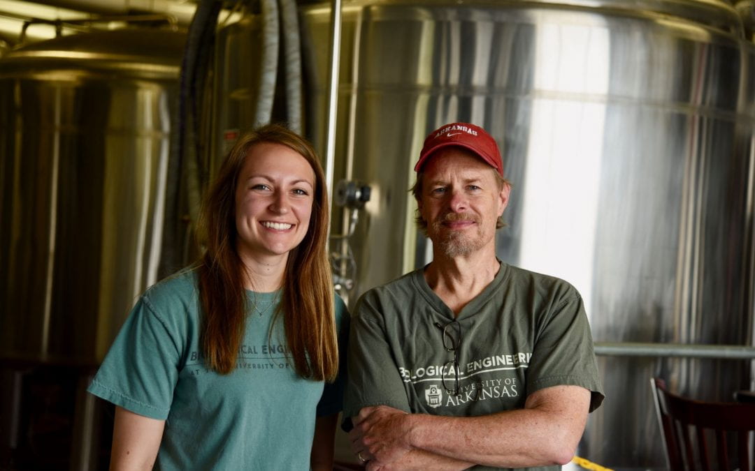 Lydia Huck and Associate Professor Scott Osborn at Core Brewing in Springdale, Arkansas. As a senior, Lydia Huck worked alongside, Natalie Von Tress, Zack Wofford and Kaylyn Zuech to help a Northwest Arkansas brewery save millions of gallons of water in the production process.
