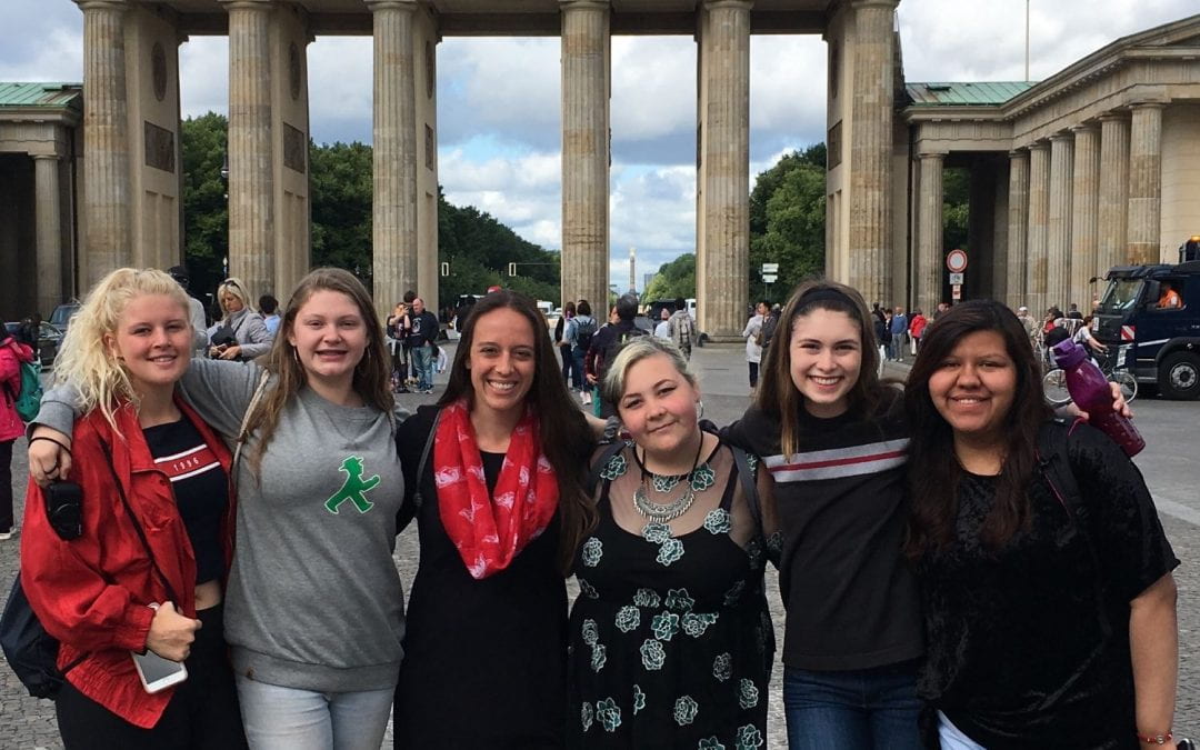 German teacher Megan Brazle (third from left) poses with Springdale High School students on a trip abroad.