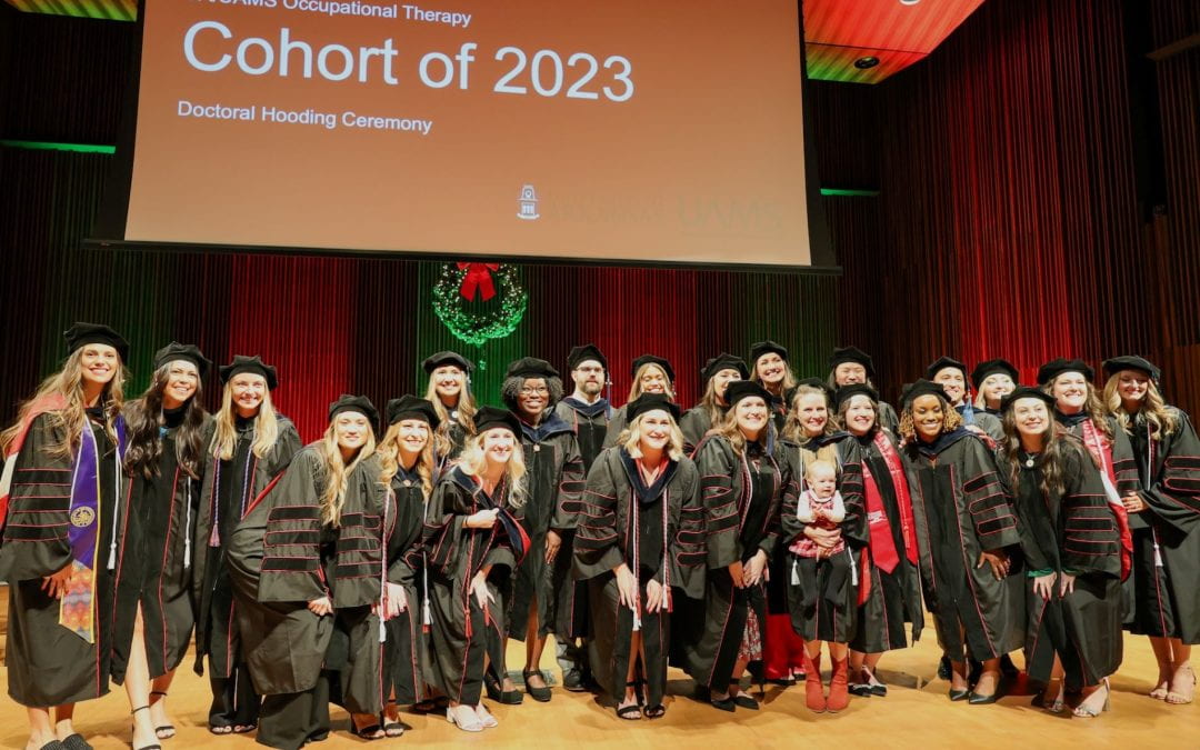 Occupational Therapy doctoral students in the 2023 cohort pose for a photo after the hooding ceremony held prior to commencement.