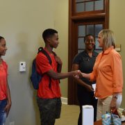 Student shakes hands with Dean Carol Gattis