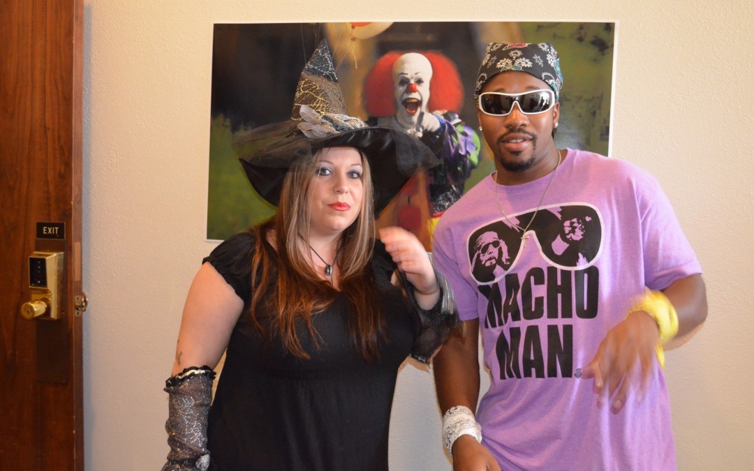 Photo of Fall Convocation Throwback, last year's witch and macho man.