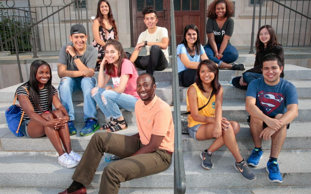 students sitting on steps outdoors