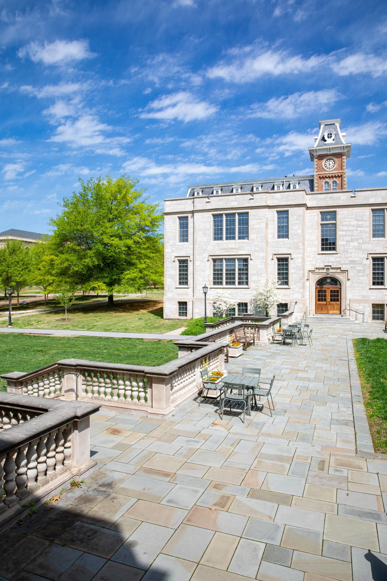 A north-facing view of the Gearhart Hall courtyard on campus, with clear blue skies and Old Main in the background.